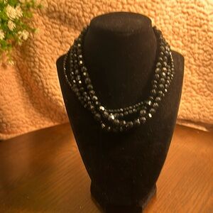 Shiny 4- strand black bead necklace, silver tone lobster closure